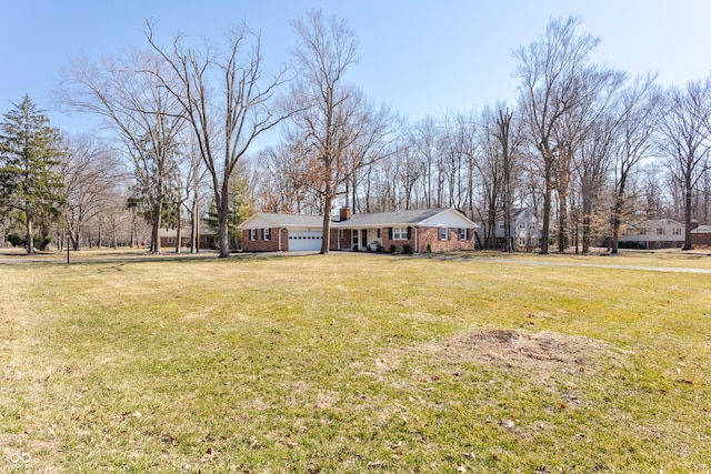 view of yard featuring an attached garage