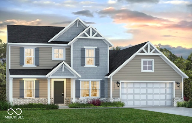 craftsman house featuring driveway, a garage, a lawn, roof with shingles, and brick siding