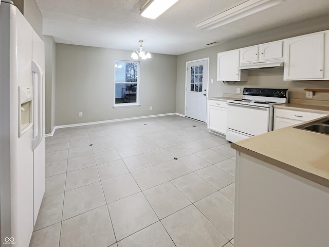 kitchen featuring white appliances, white cabinets, light countertops, a textured ceiling, and under cabinet range hood