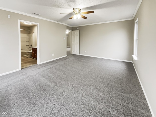 unfurnished bedroom with baseboards, carpet floors, and crown molding