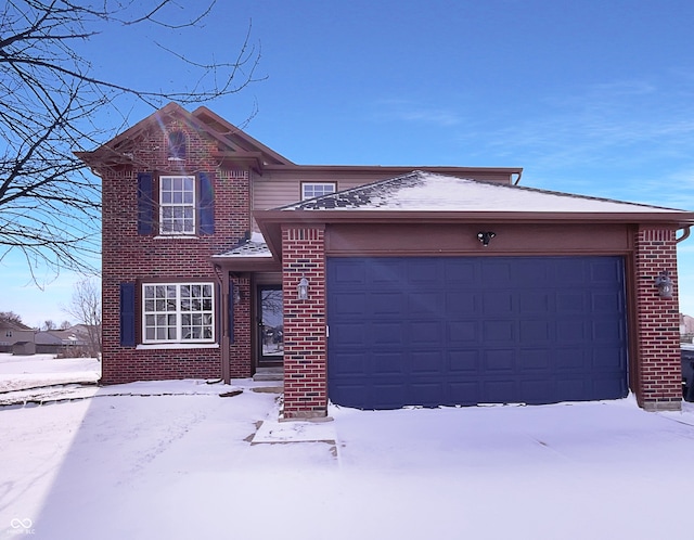 traditional-style house with a garage and brick siding