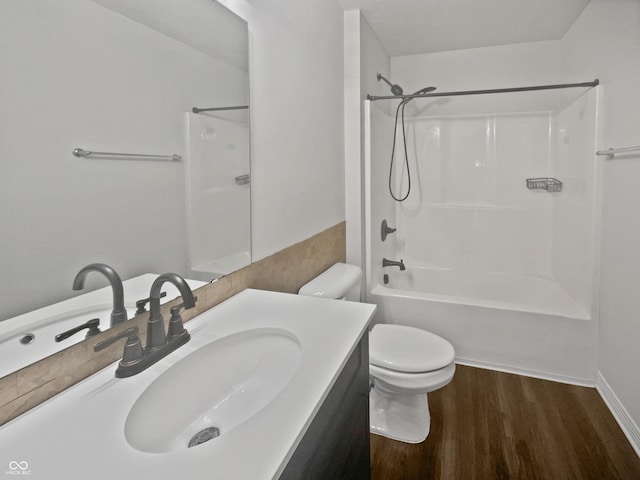 bathroom featuring shower / bathing tub combination, vanity, toilet, and wood finished floors