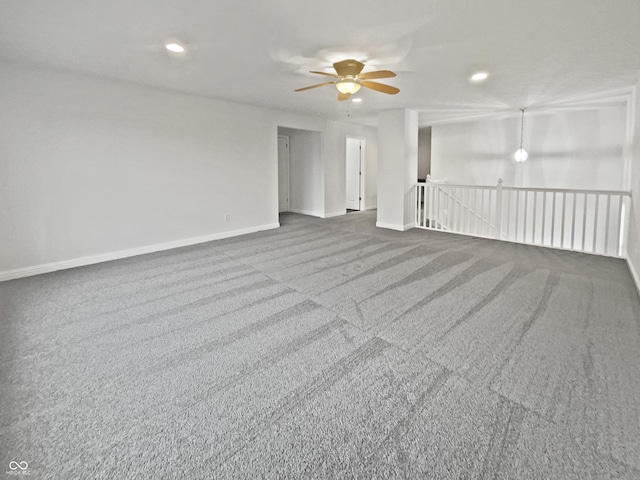 carpeted empty room with a ceiling fan, recessed lighting, and baseboards