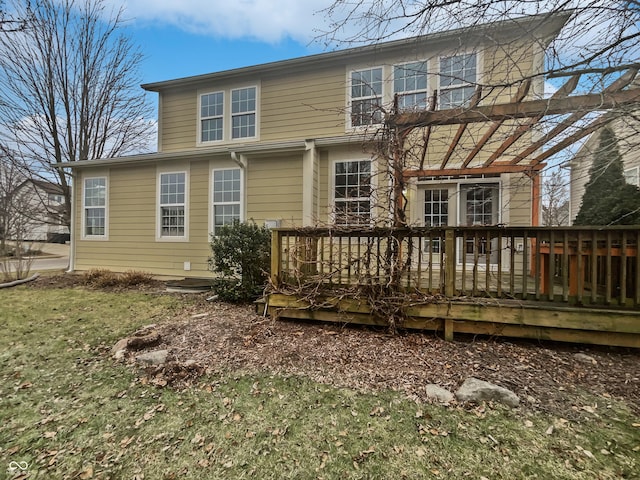 back of property featuring a wooden deck