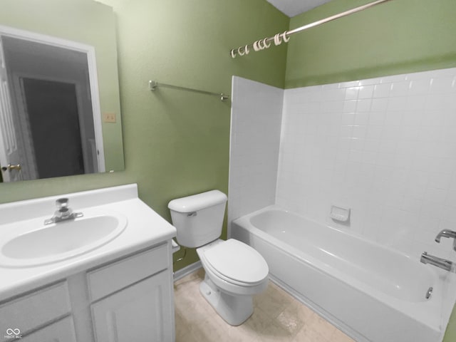 full bathroom with toilet, baseboards, shower / bathing tub combination, and vanity