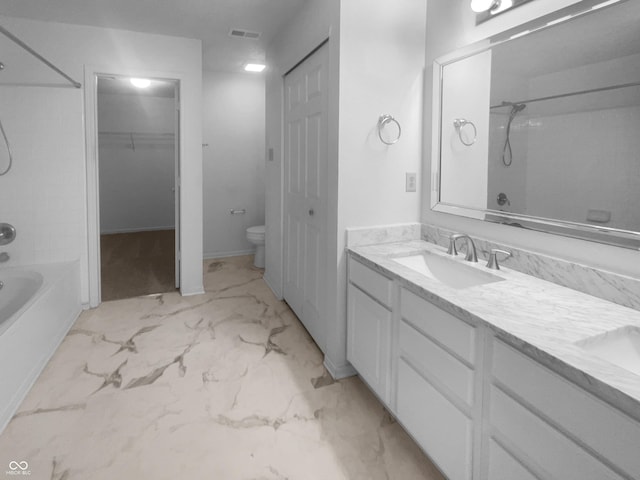 full bath featuring marble finish floor, bathtub / shower combination, visible vents, toilet, and a sink