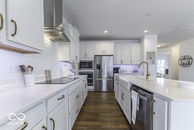 4078 Omaha Dr, Bargersville, IN 46106 - kitchen featuring light countertops, appliances with stainless steel finishes, white cabinets, a sink, and wall chimney exhaust hood