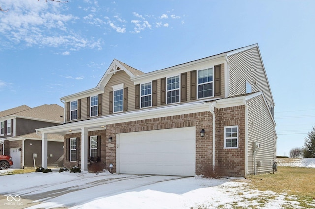 view of front of property featuring a garage and brick siding