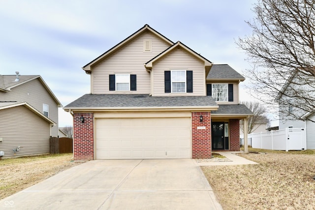 traditional home with a garage, fence, and brick siding