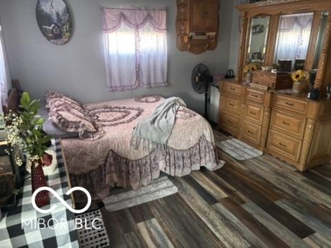 bedroom featuring wood finished floors