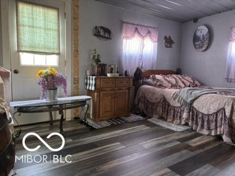 bedroom with wood finished floors