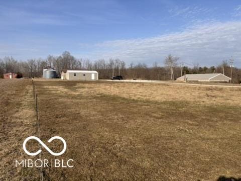 view of yard with a rural view