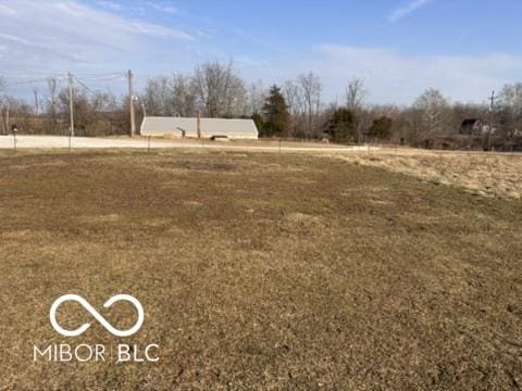 view of yard with a rural view