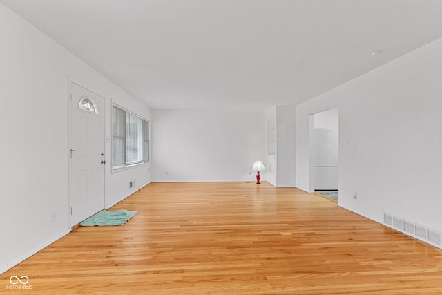 interior space featuring wood finished floors and visible vents