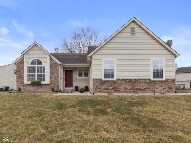 ranch-style house with brick siding and a front lawn