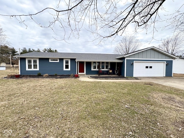 ranch-style home with a garage, driveway, a porch, board and batten siding, and a front yard