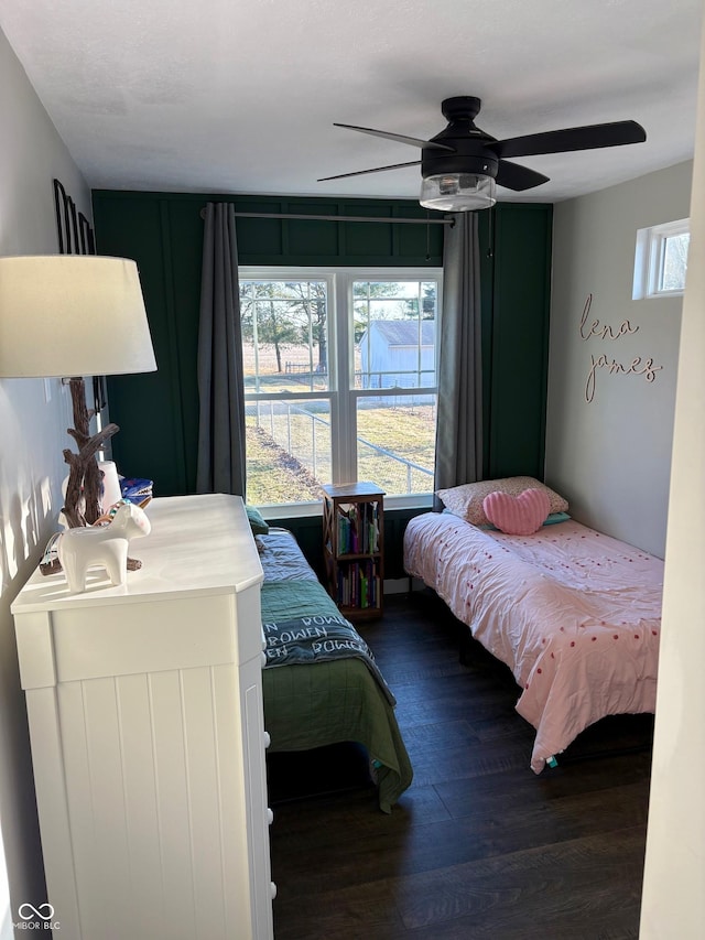 bedroom with ceiling fan and wood finished floors