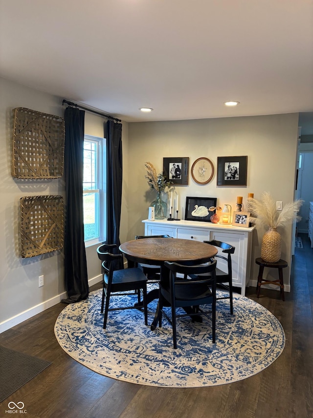 dining room with recessed lighting, baseboards, and wood finished floors