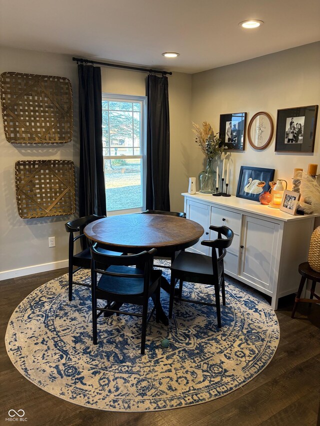 dining room with baseboards, dark wood-type flooring, and recessed lighting