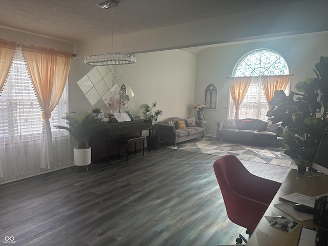 home office featuring a textured ceiling and wood finished floors