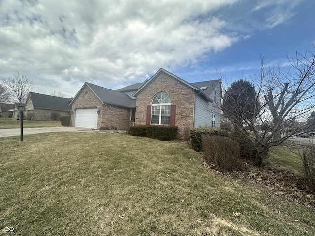 view of front of property featuring an attached garage, a front lawn, concrete driveway, and brick siding