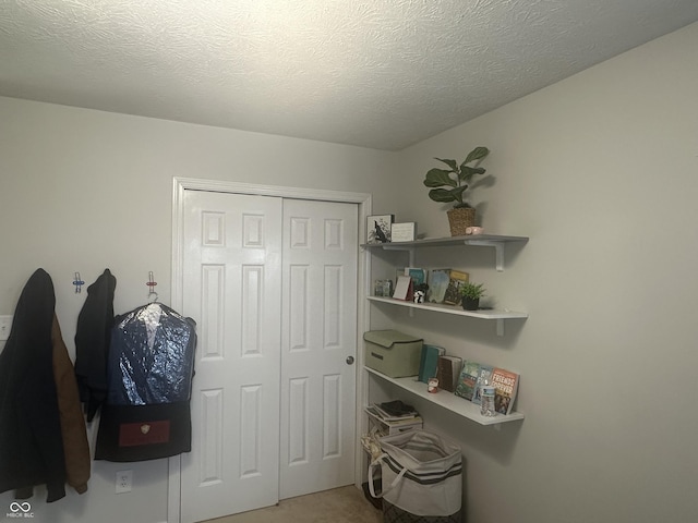 interior space featuring a textured ceiling