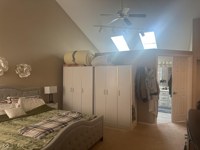 bedroom with high vaulted ceiling, a ceiling fan, and light colored carpet