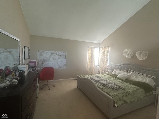 bedroom featuring baseboards, vaulted ceiling, and light colored carpet