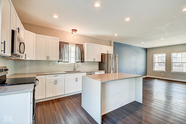 2308 Nowland Ave, Indianapolis, IN 46201 - kitchen featuring dark wood-style floors, white cabinetry, stainless steel appliances, and a sink