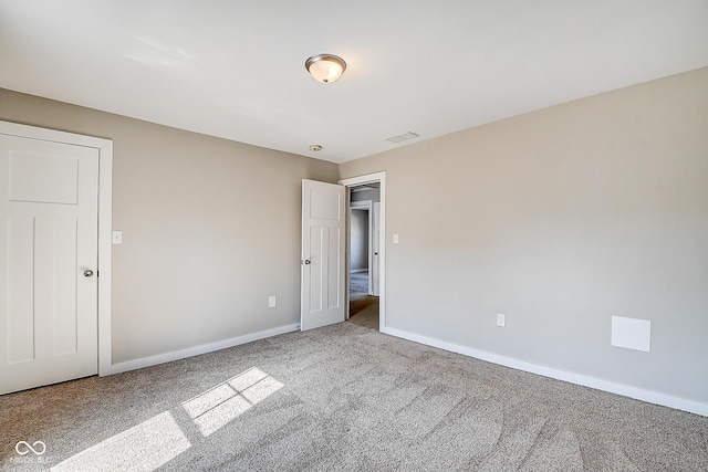 2308 Nowland Ave, Indianapolis, IN 46201 - unfurnished bedroom featuring carpet floors, visible vents, and baseboards