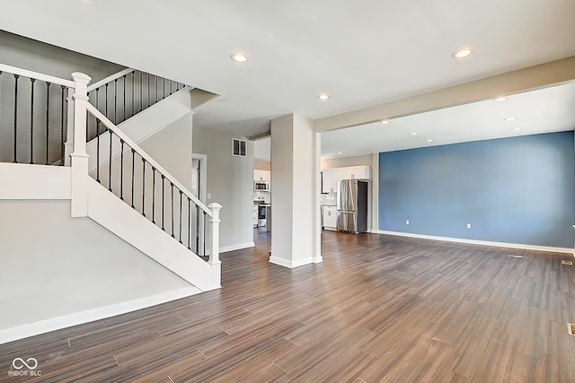 2308 Nowland Ave, Indianapolis, IN 46201 - interior space featuring recessed lighting, dark wood-style flooring, visible vents, baseboards, and stairs