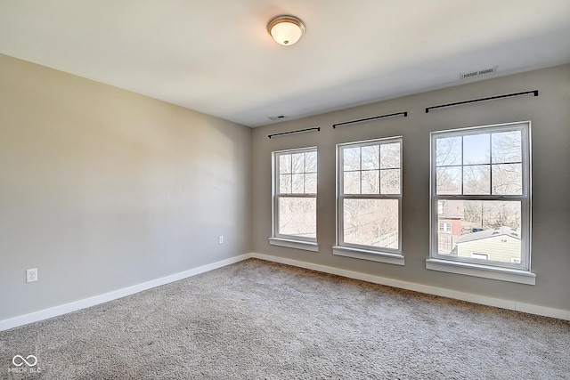 2308 Nowland Ave, Indianapolis, IN 46201 - unfurnished room with baseboards, visible vents, and carpet flooring