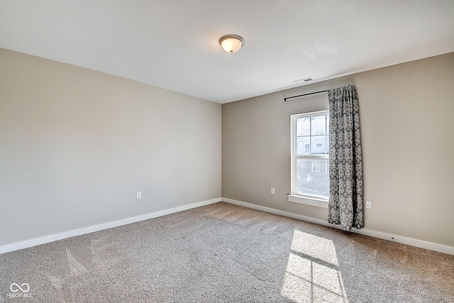 2308 Nowland Ave, Indianapolis, IN 46201 - carpeted empty room with visible vents and baseboards