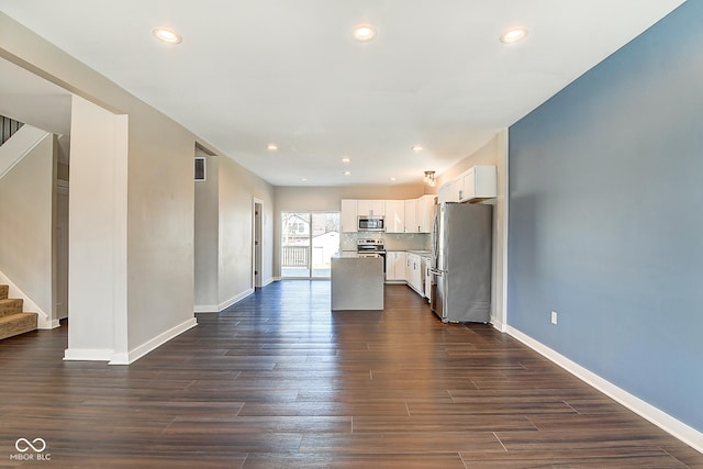 2308 Nowland Ave, Indianapolis, IN 46201 - kitchen featuring visible vents, white cabinets, dark wood-style floors, stainless steel appliances, and recessed lighting