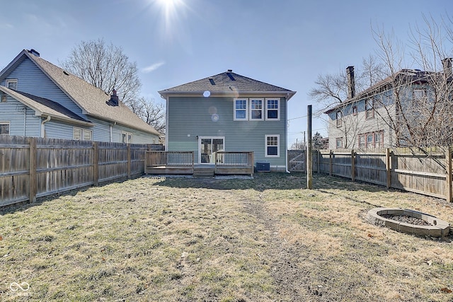 2308 Nowland Ave, Indianapolis, IN 46201 - rear view of property with a fenced backyard, a lawn, and a wooden deck