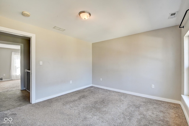 2308 Nowland Ave, Indianapolis, IN 46201 - empty room with carpet floors, visible vents, and baseboards