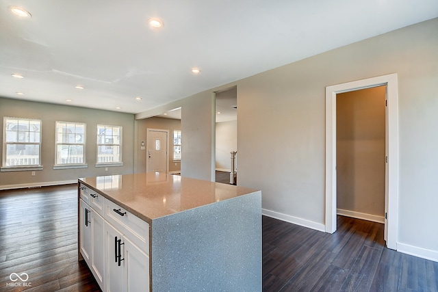 2308 Nowland Ave, Indianapolis, IN 46201 - kitchen featuring baseboards, white cabinets, and dark wood-style flooring