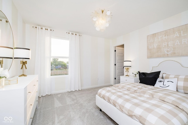 bedroom with light carpet and baseboards