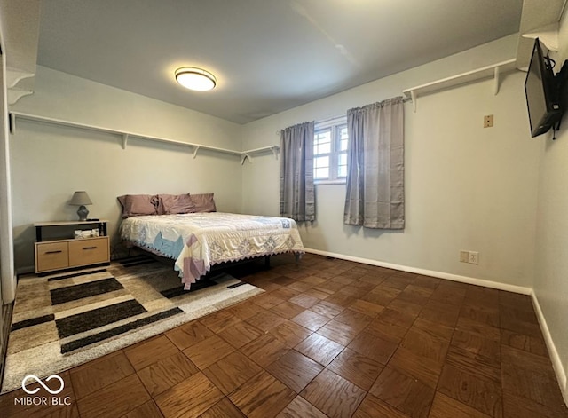 bedroom featuring baseboards