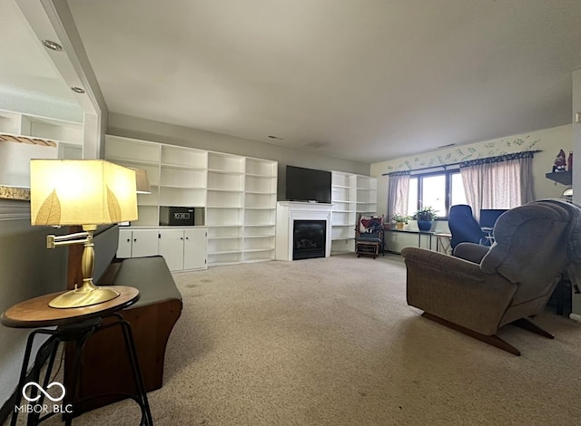 carpeted living room with a fireplace