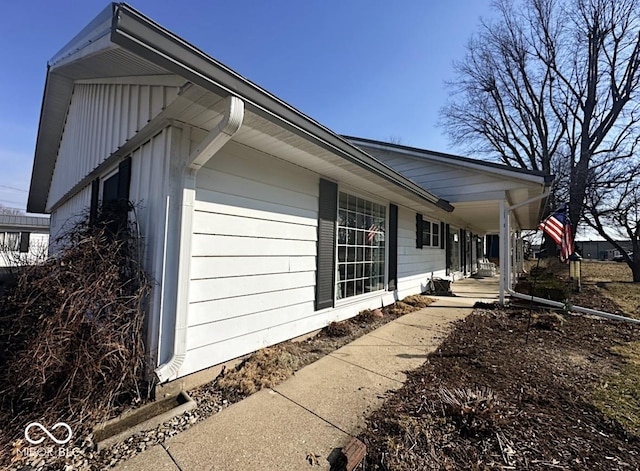 view of side of property featuring a porch