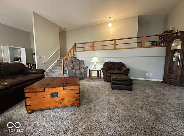 carpeted living area featuring lofted ceiling