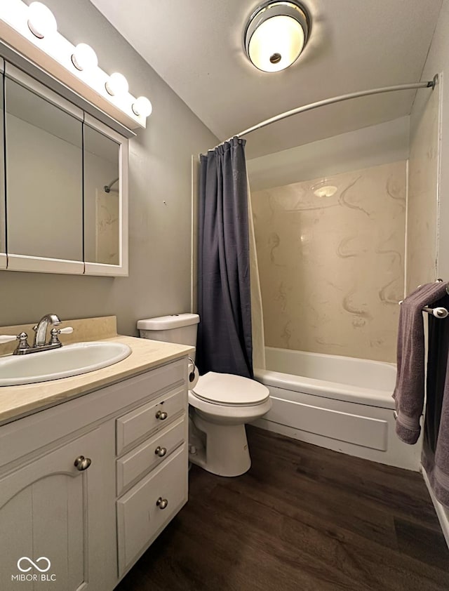 bathroom with toilet, vanity, wood finished floors, and shower / tub combo with curtain