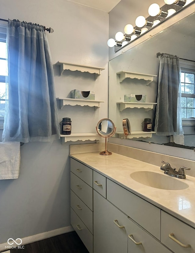 bathroom featuring vanity and baseboards