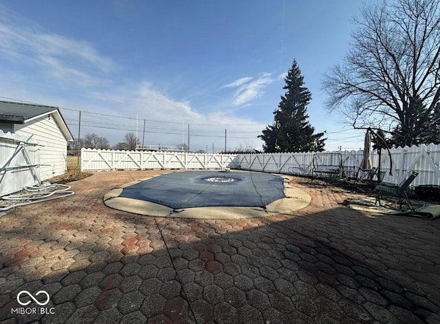 exterior space with a fenced backyard and a patio