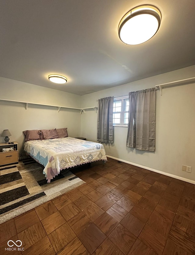 bedroom featuring baseboards