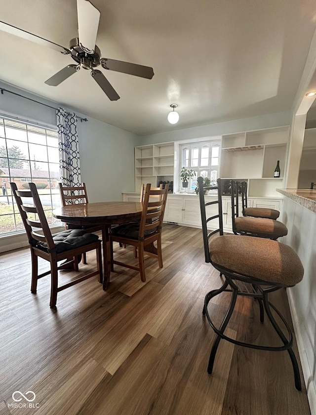 dining area featuring dark wood-style floors