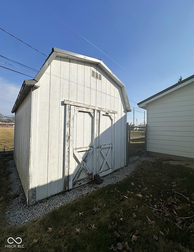 view of shed with fence