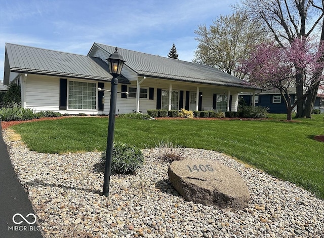 1406 Durham Dr, Crawfordsville, IN 47933 - ranch-style home featuring a porch, a front yard, and metal roof