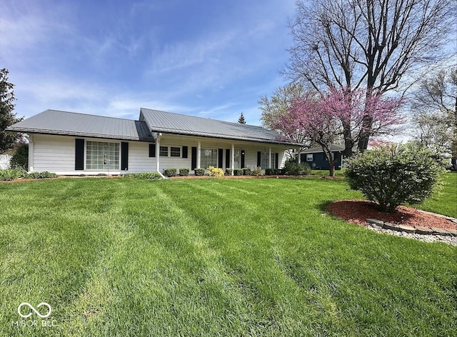 1406 Durham Dr, Crawfordsville, IN 47933 - view of front of home with a front lawn, a porch, and metal roof